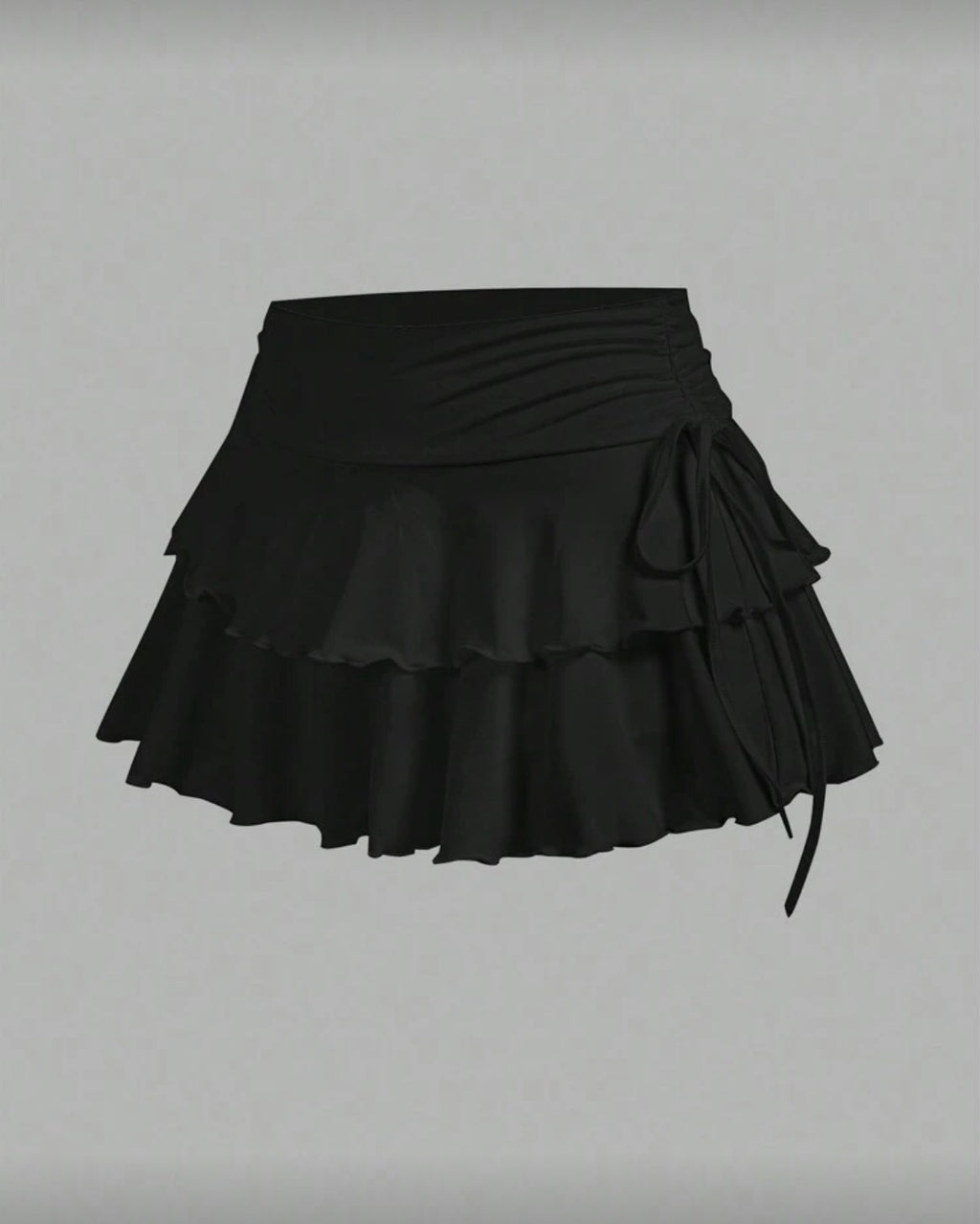 Falda short tablones con moño