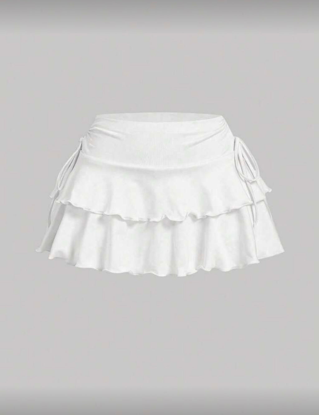 Falda short tablones con moño