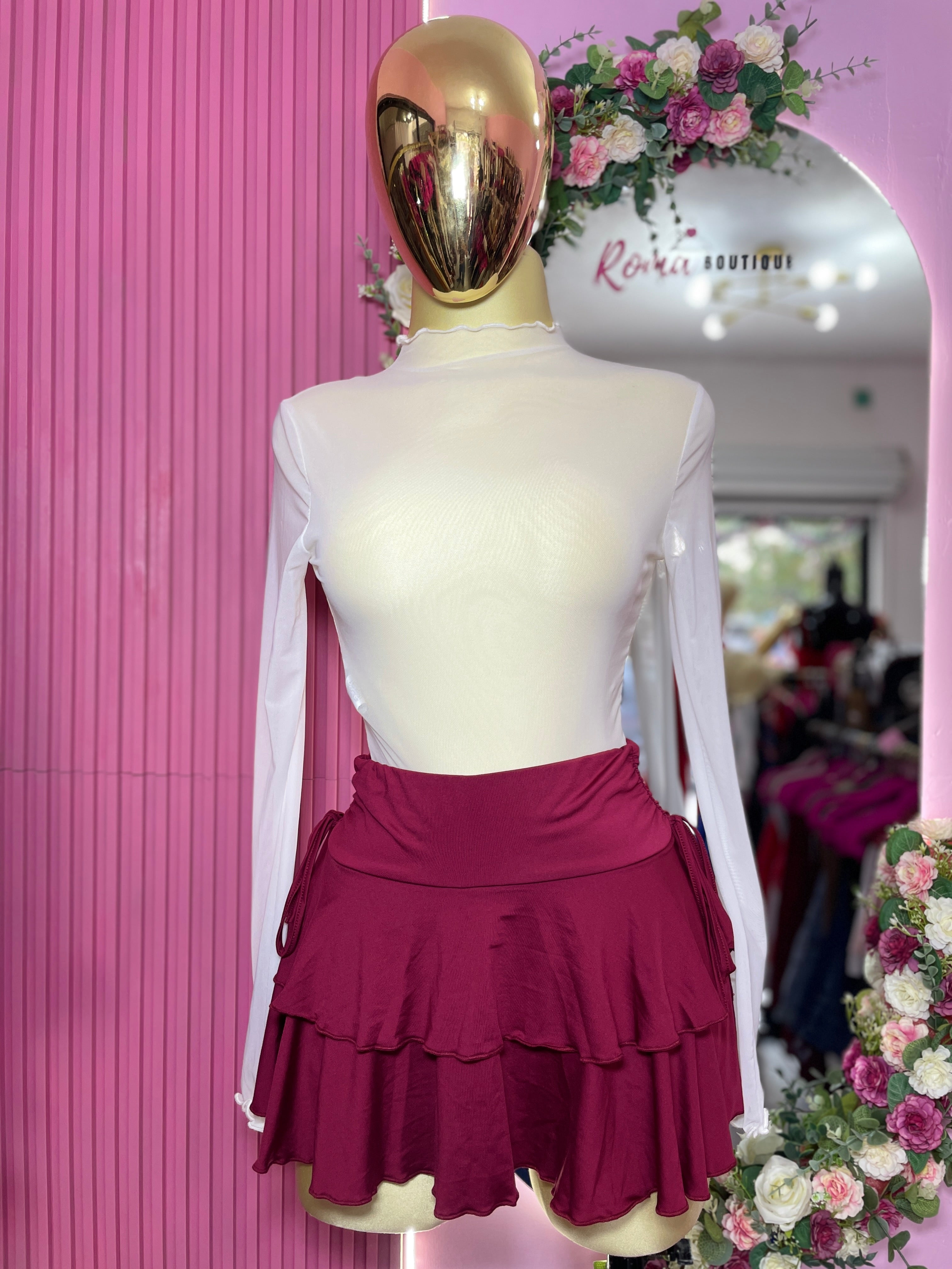 Falda short tablones con moño